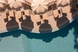 A poolside area with multiple beige umbrellas and lounge chairs. - Bellevue Maradiso Village by Aminess (Orebic)