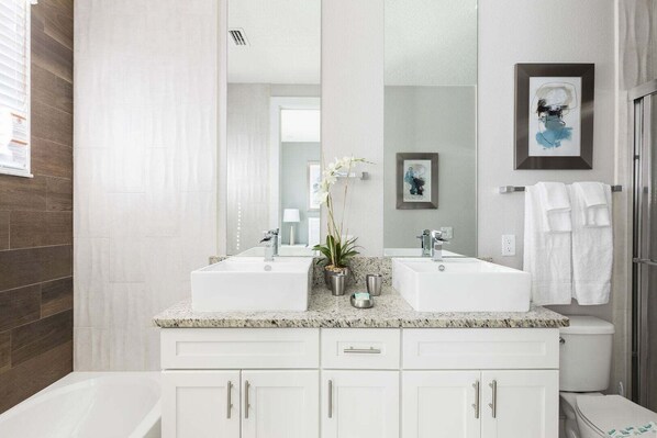Combined shower/bathtub, hair dryer, towels, soap