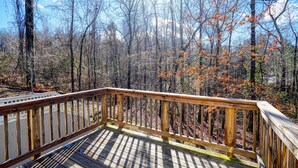 A wooden deck with a view of a forested area. - Lovely Long Term/STR Corporate, Family Near I20,Airport,Downtown,Airport (Austell)