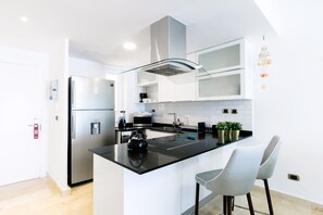 Fridge, microwave, stovetop, coffee/tea maker