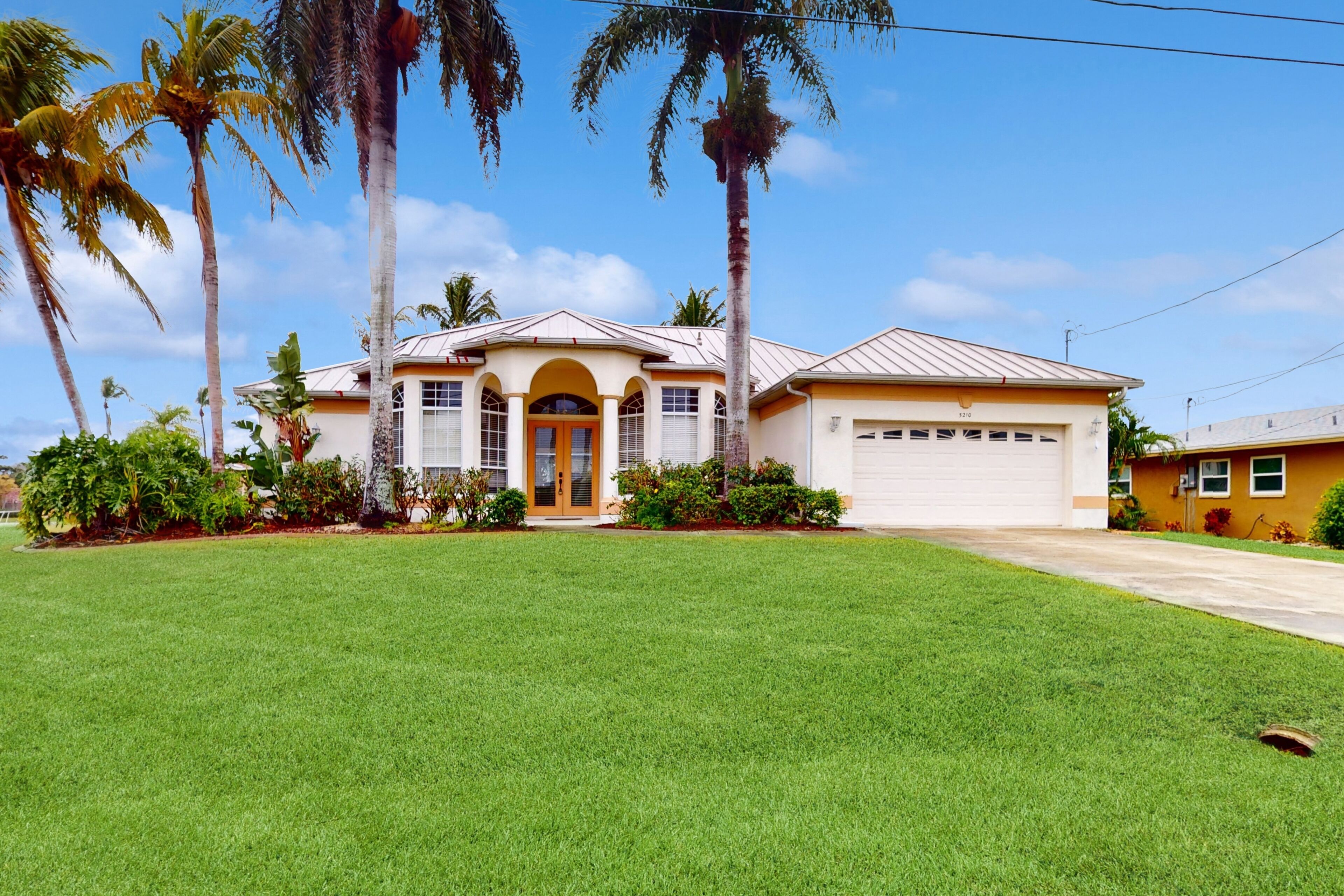 Spacious, canal-front home with pool, furnished lanai, dock, & Gulf access