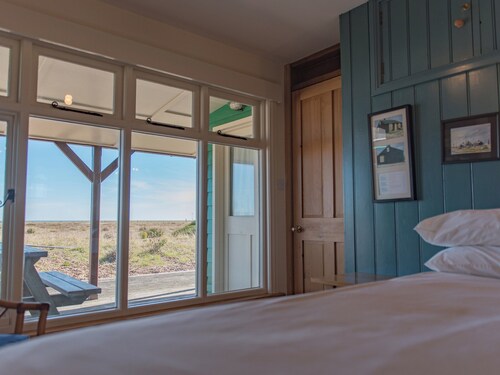 Quirky holiday cottage right on the beach at Dungeness in Kent.