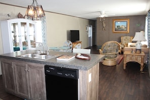 Enjoy a functional and welcoming home environment with a well-equipped kitchen and cozy living area.