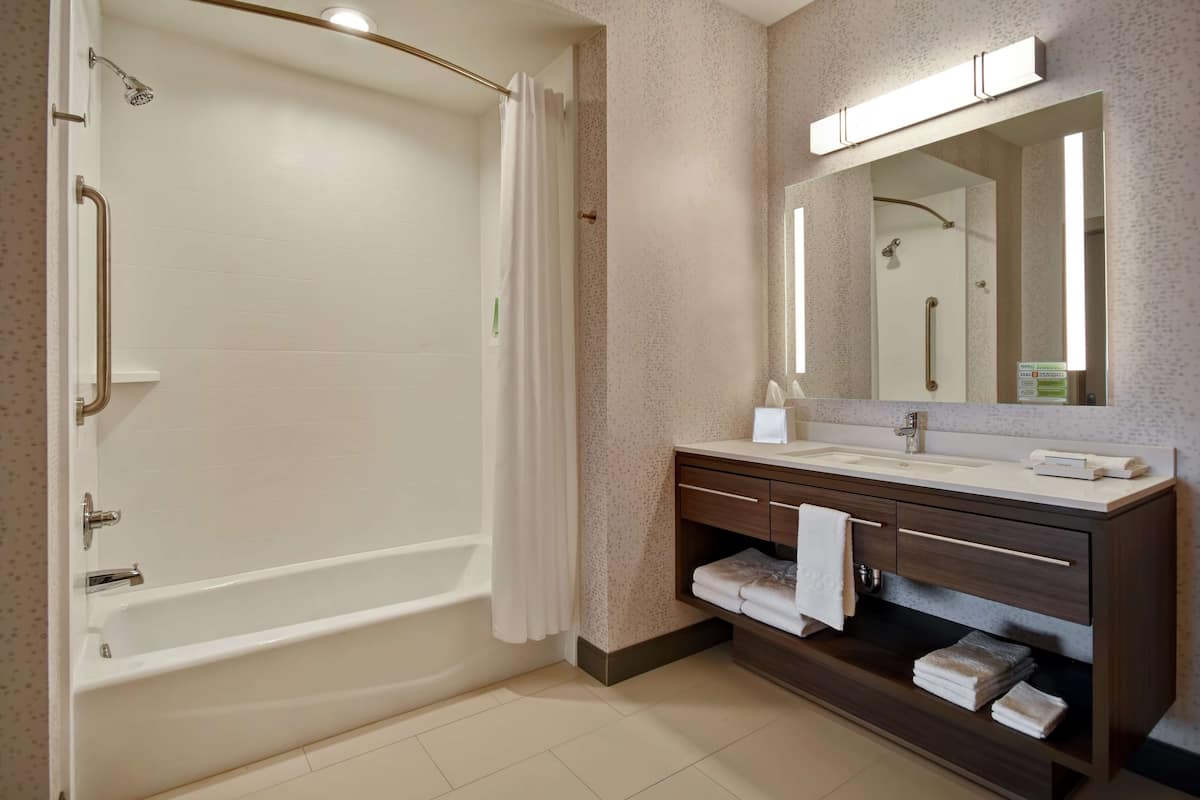 suite, 1 queen bed, accessible (hearing) | bathroom | bathrobes, towels