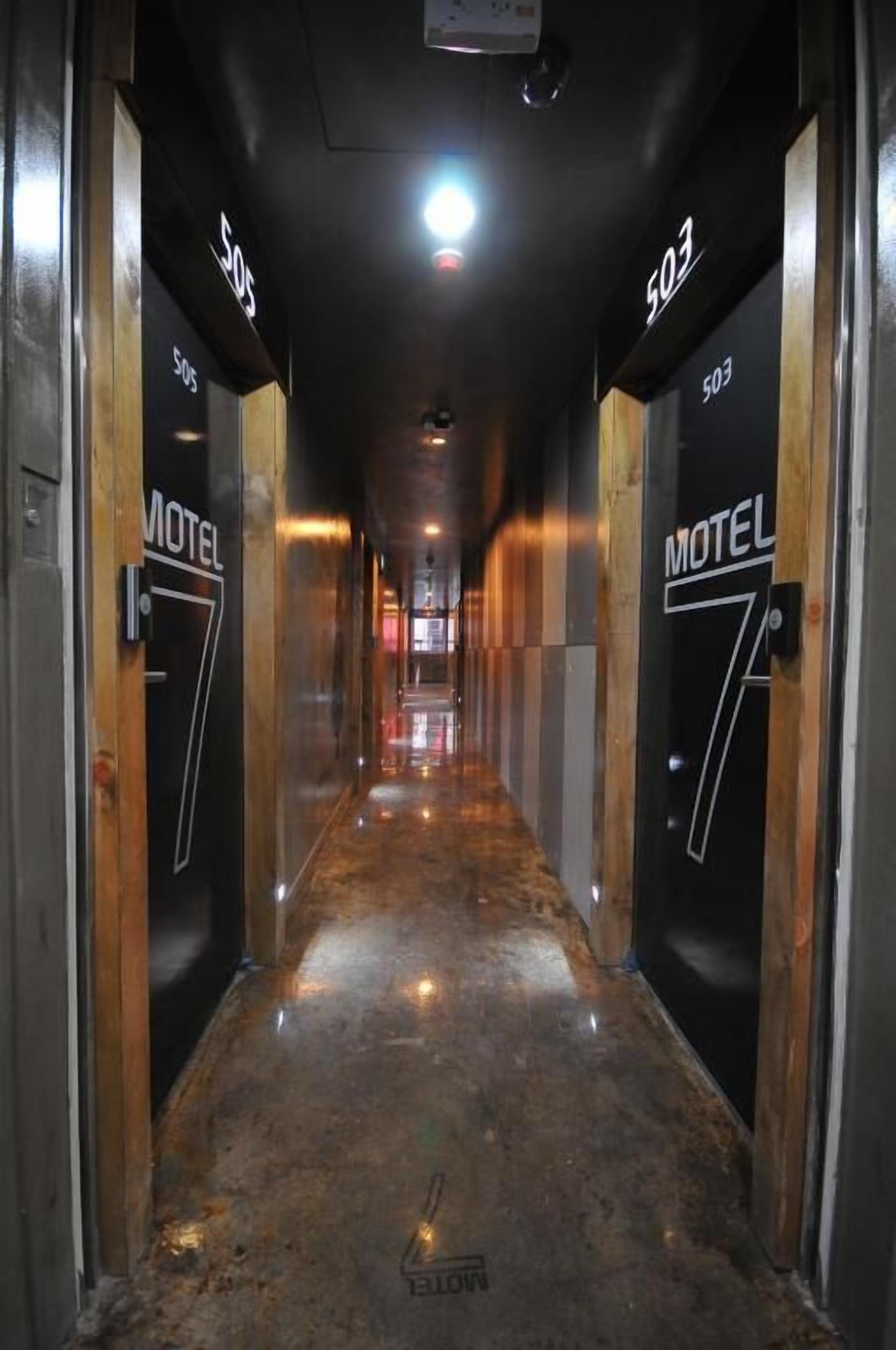 A hallway with doors labeled 'Motel 7' and '503'.