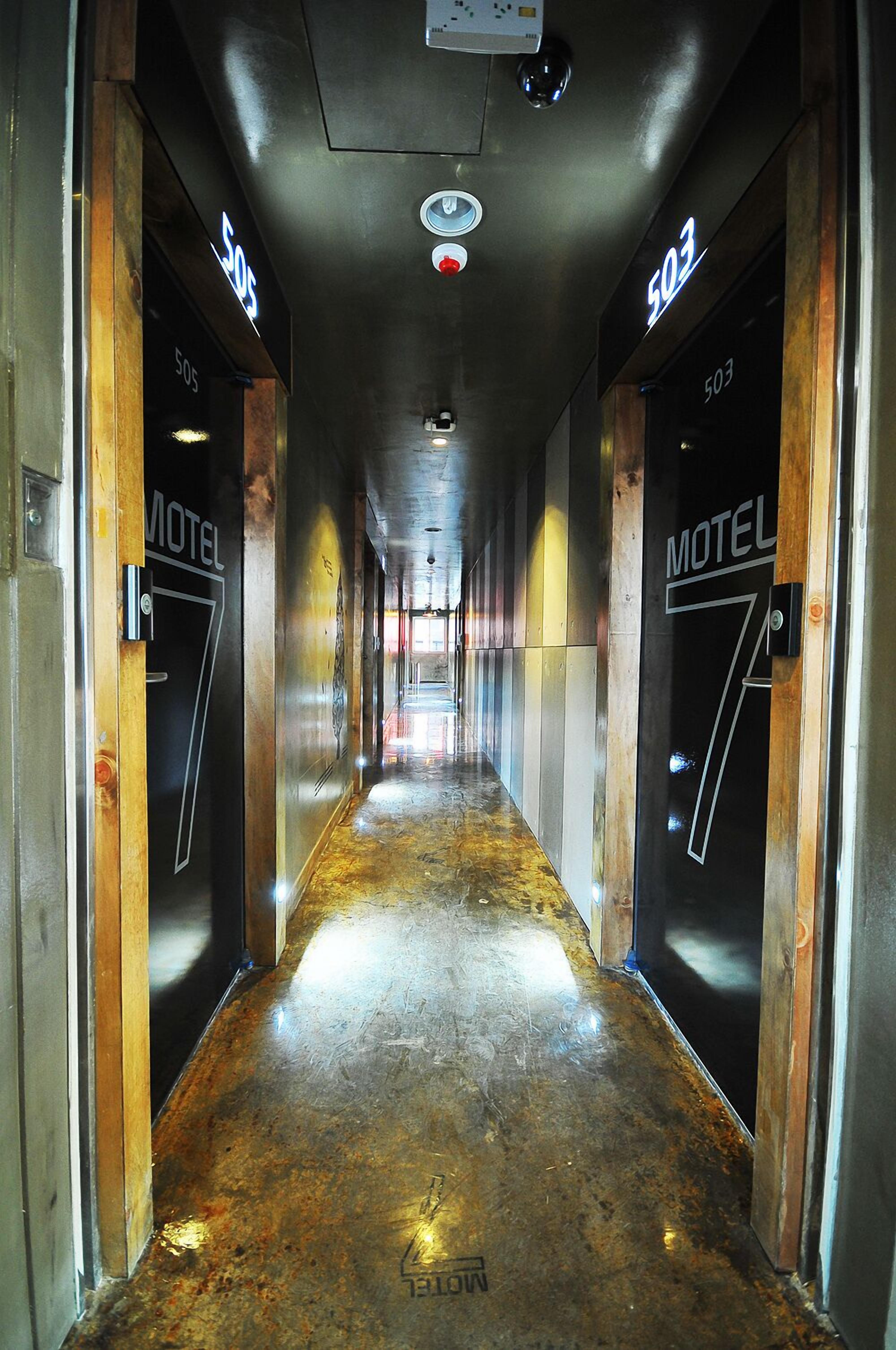 A corridor with doors labeled '505 Motel 7' and '503 Motel 7'.