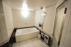 Separate tub and shower, free toiletries, hair dryer, slippers