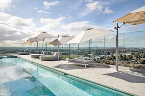 Outdoor pool, open 6:00 AM to 10:00 PM, pool umbrellas, sun loungers