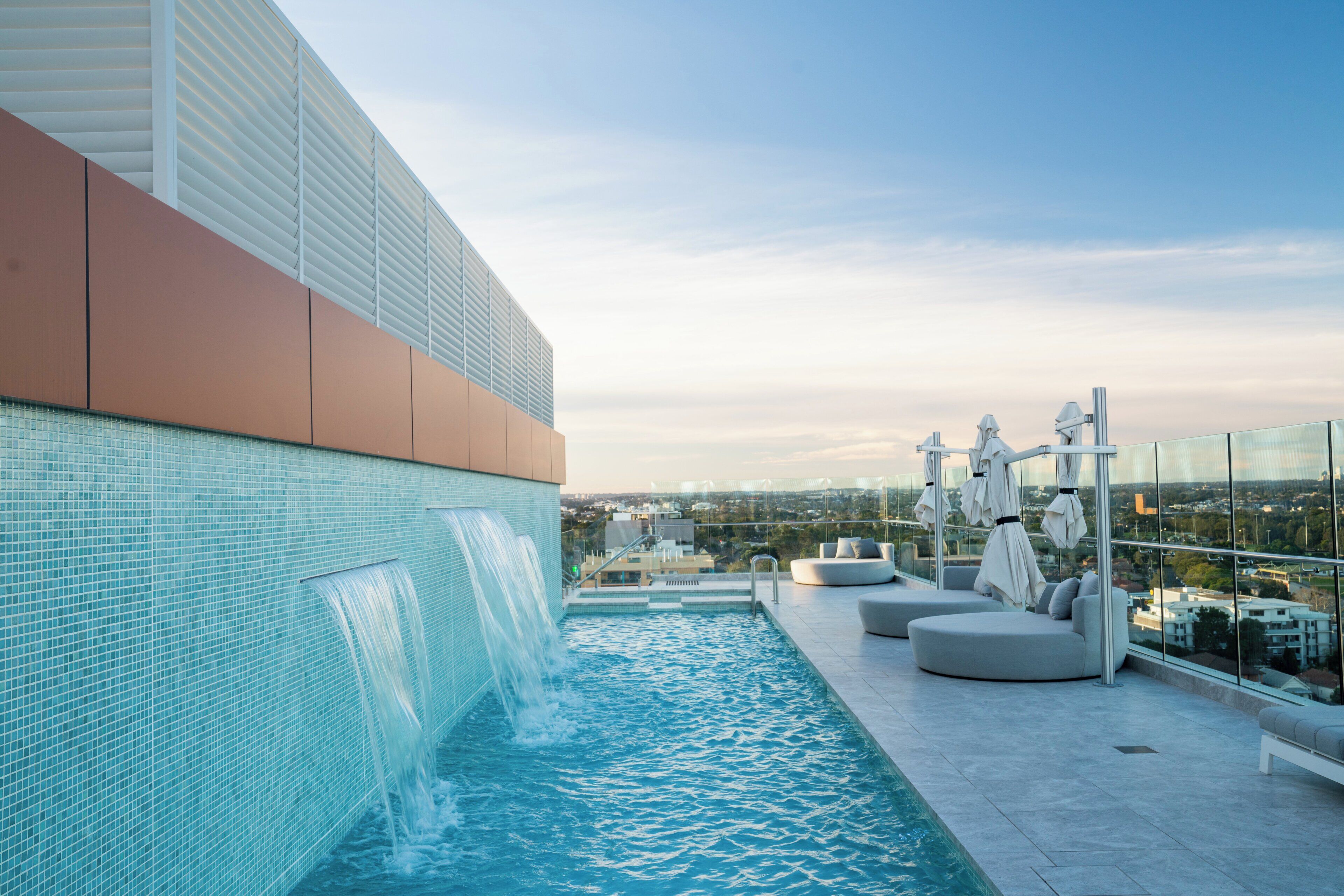 Outdoor pool, open 6:00 AM to 10:00 PM, pool umbrellas, pool loungers