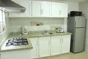 Fridge, microwave, stovetop, coffee/tea maker