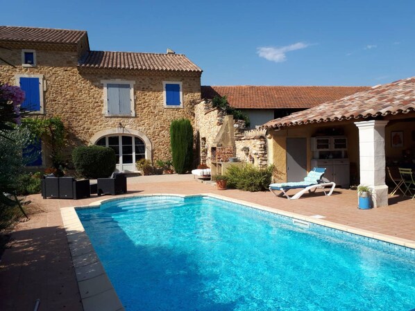 Seasonal outdoor pool, pool loungers
