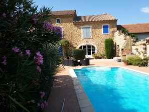 Seasonal outdoor pool, pool loungers