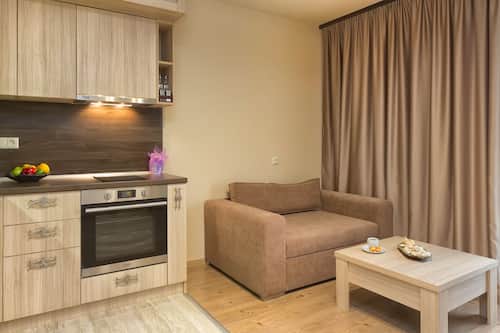Apartment, 1 Bedroom, Pool View | Premium bedding, memory-foam beds, in-room safe, desk