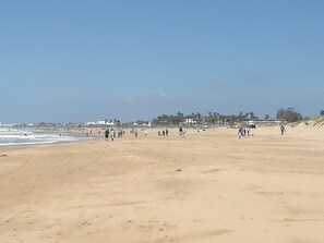 On the beach, sun-loungers, beach towels