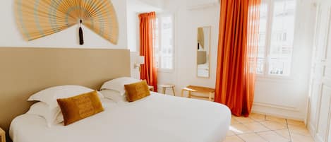 Triple Room | 1 bedroom, minibar, in-room safe, individually decorated