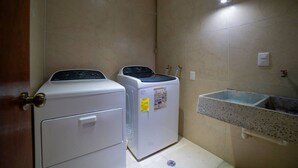 A laundry room with two washing machines and a sink. - Comfortable apartment in Masaryk Avenue 1A (Polanco)
