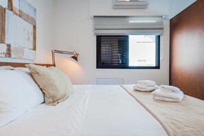 Apartamento (1 Bedroom) | 1 quarto, ferros/tábuas de passar roupa, roupa de cama