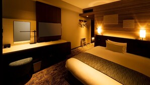 A hotel room with a bed, a desk, a chair, a TV, and a coat rack. - Shizutetsu Hotel Prezio Tokyo Tamachi (Tokyo)