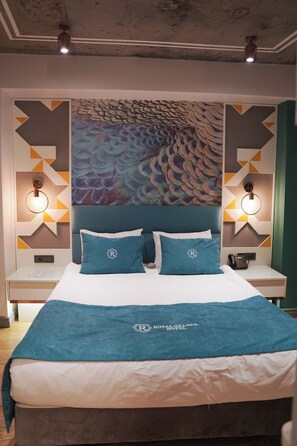 Habitación cuádruple Confort | Ropa de cama hipoalergénica y artículos del minibar gratis 