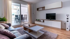 A modern living room with a sofa, coffee table, TV, and cabinets. - Salamandra Altea 17 By Vero (Altea)