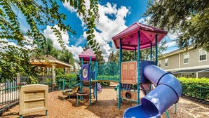 A playground with a slide, climbing structures, and a 'Park Ranger' sign. - ✦Best Deal✦Cozy Home w/ WiFi, Baby Gear, 6mi to Disney, Onsite Theatre/Pool✦ (Kissimmee)