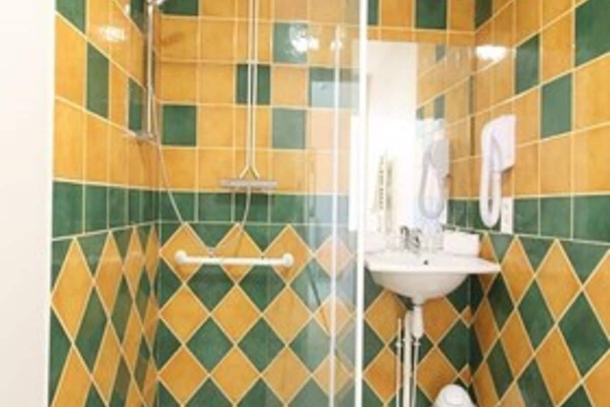 superior double room | bathroom | shower, free toiletries, hair dryer, towels