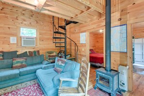 TV, fireplace, books - Near Snowmobiling: Secluded Harmony Cabin w/ Deck! (Harmony)