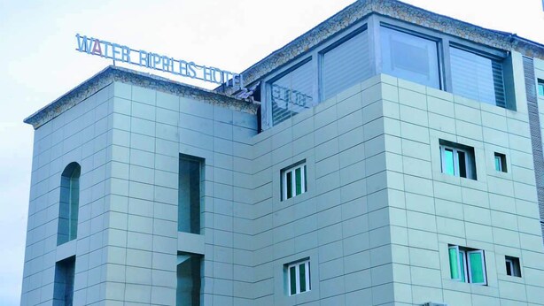 A modern hotel building with a sign reading "WATER BIPHILIS HOTEL." - Water Ripples Hotel (Lekki)