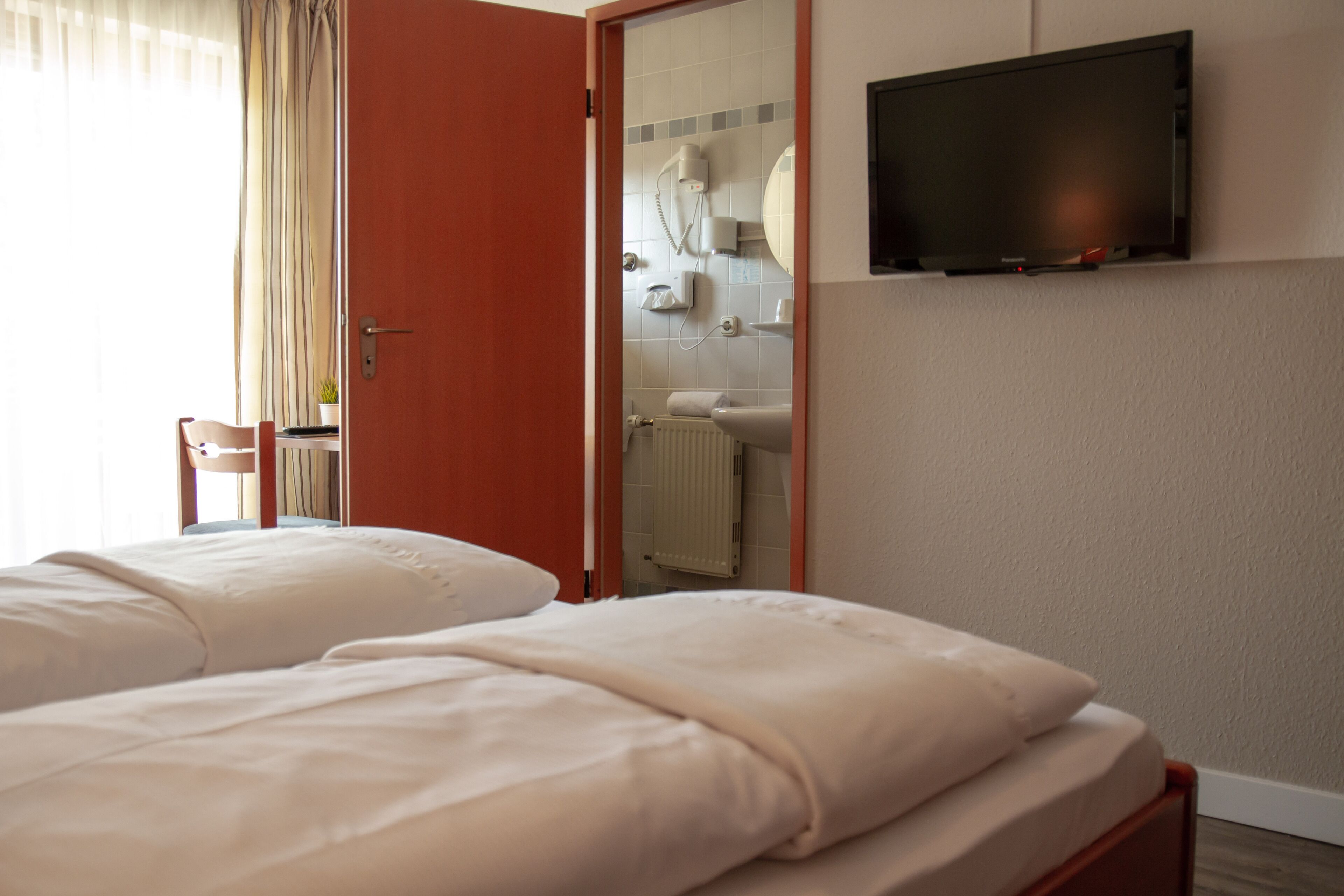 desk, laptop workspace, blackout curtains, iron/ironing board