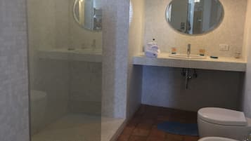 Bathtub, hair dryer, bidet, towels