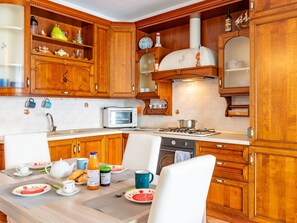 Fridge, oven, cookware/dishes/utensils