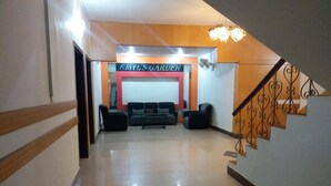 A hallway leading to a reception area with a sign reading "AMY'S GARDEN". - Amyls garden (Islamabad)