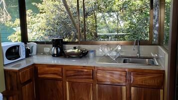 Microwave, stovetop, coffee/tea maker, cookware/dishes/utensils