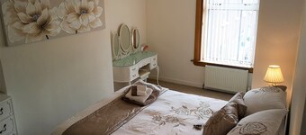 Bright, spacious centrally-located 3-bedroomed house with ample free parking.