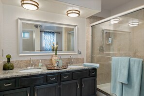 Combined shower/tub, hair dryer, towels, soap