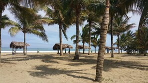 On the beach, free beach cabanas, beach towels, beach massages
