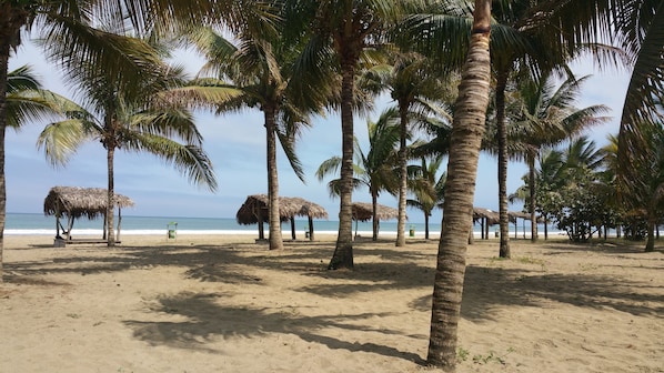 On the beach, free beach cabanas, beach towels, beach massages