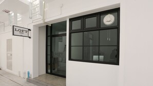 A modern building entrance with a sign reading "LOFT SERIES". - Loft Series (Krabi)