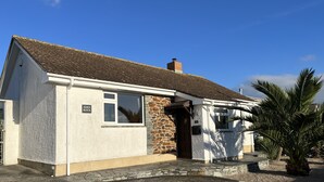 A two-story building with a stone facade and a tiled roof. - Eden Rock is an immaculately presented bungalow situated in the heart of Rock. (Rock, Wadebridge)