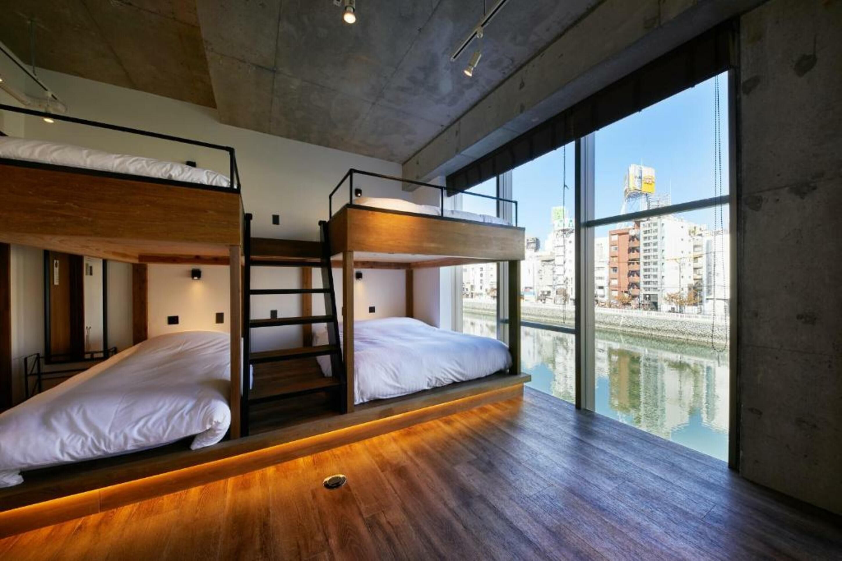 deluxe studio, multiple beds, non smoking, river view | living area | lcd tv, tablet