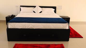 Suite Deluxe, varias camas | 1 habitación, ropa de cama de alta calidad y muebles diferentes