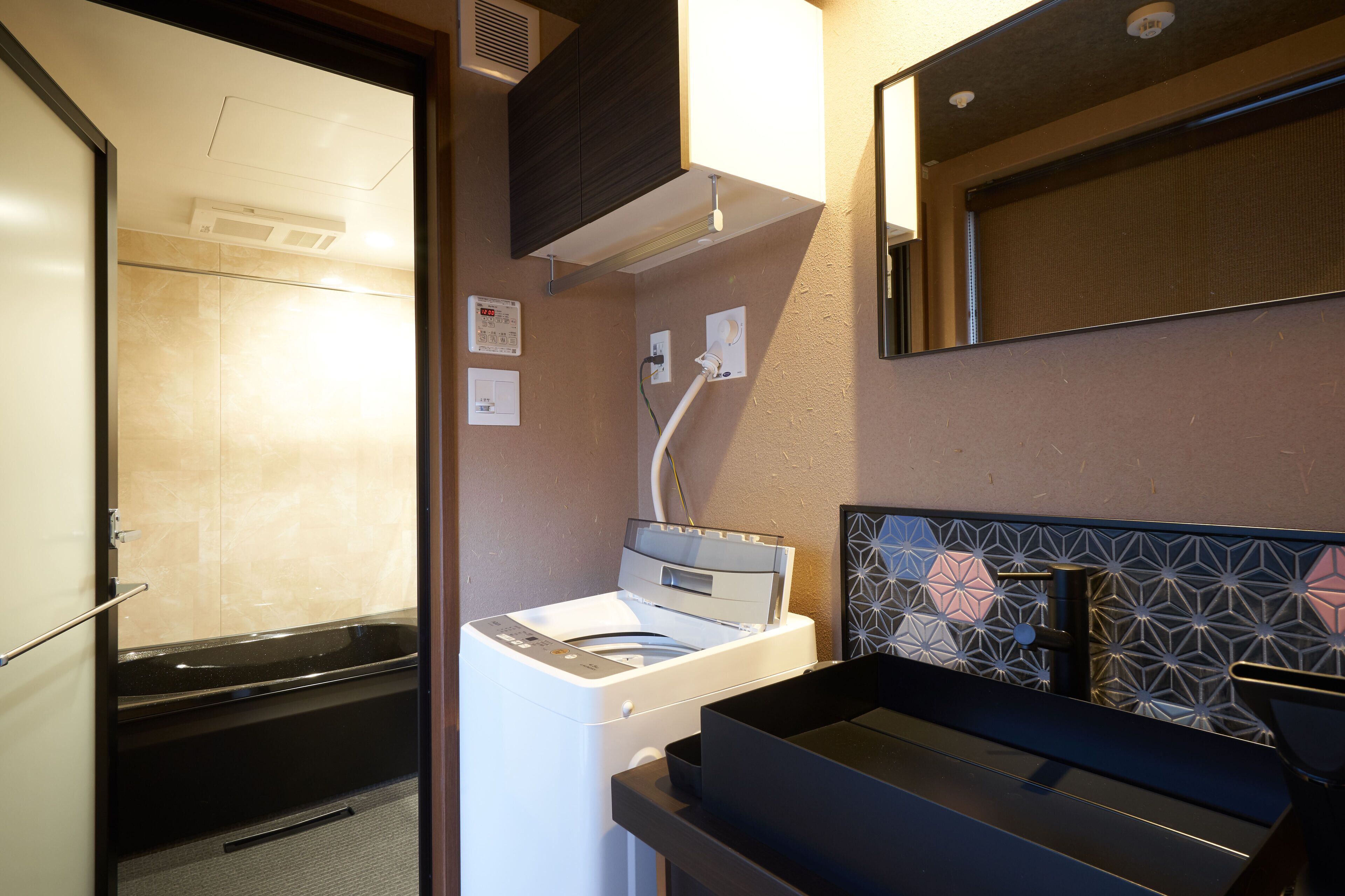 Deluxe Room, Non Smoking | Bathroom | Separate bathtub and shower, free toiletries, hair dryer, slippers