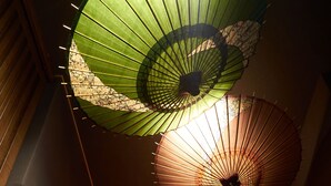 A corridor with a series of hanging umbrellas. - Private Hotel Kanazawa SHIKI (Kanazawa)