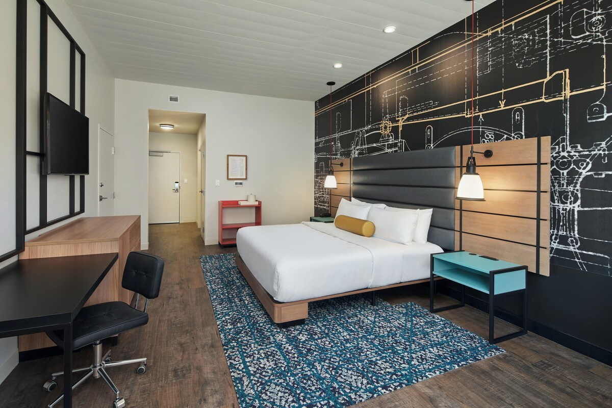 Premium bedding, desk, laptop workspace, soundproofing