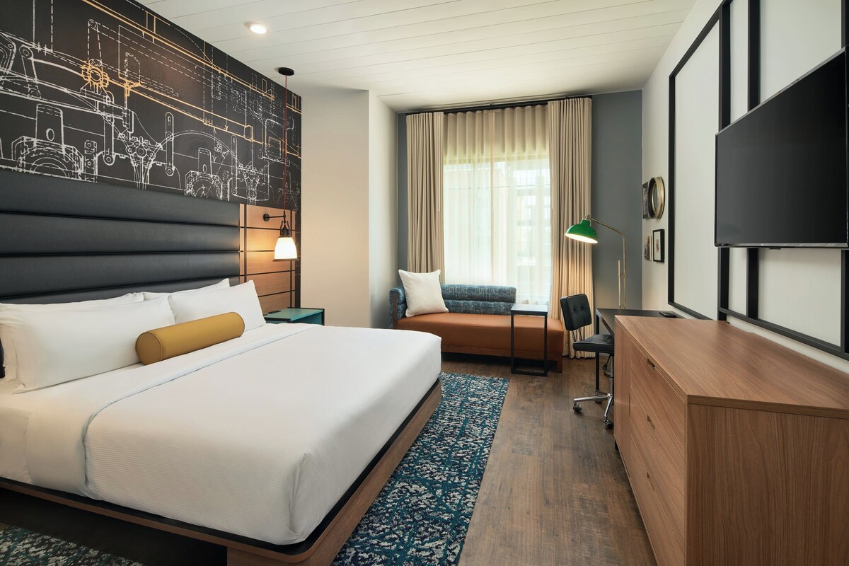 Premium bedding, desk, laptop workspace, soundproofing