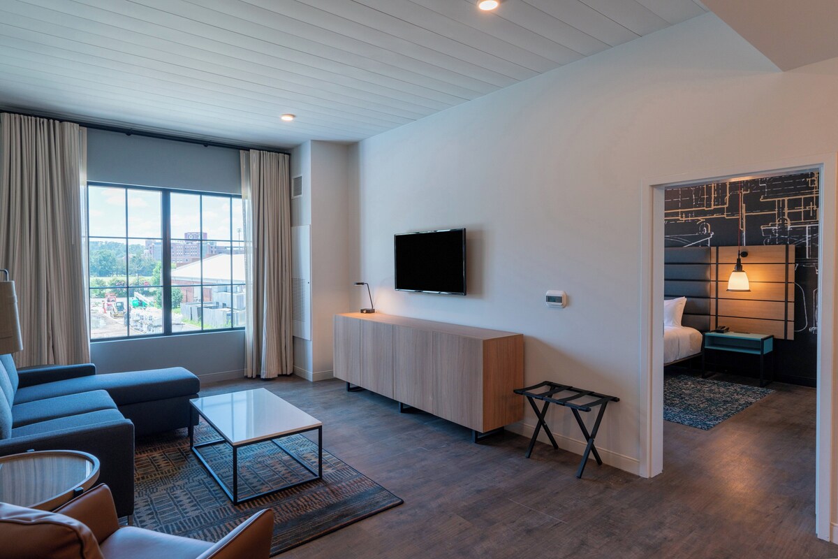 Premium bedding, desk, laptop workspace, soundproofing