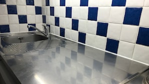 A stainless steel kitchen counter with a sink and a faucet. - Studio at slopes, south-facing balcony (Corrençon-en-Vercors)