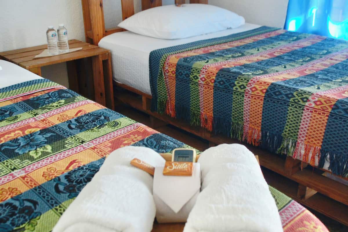 Premium bedding, desk, laptop workspace, blackout drapes