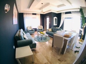 Apartment, 3 Bedrooms | Living area | 55-inch Smart TV with satellite channels, TV, MP3 dock - Marvelous Rooftop (Amman)