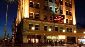 A multi-story hotel with a classic architectural design, featuring a prominent marquee sign on the front. - Great View! Wilma Building - Downtown Missoula (Missoula)
